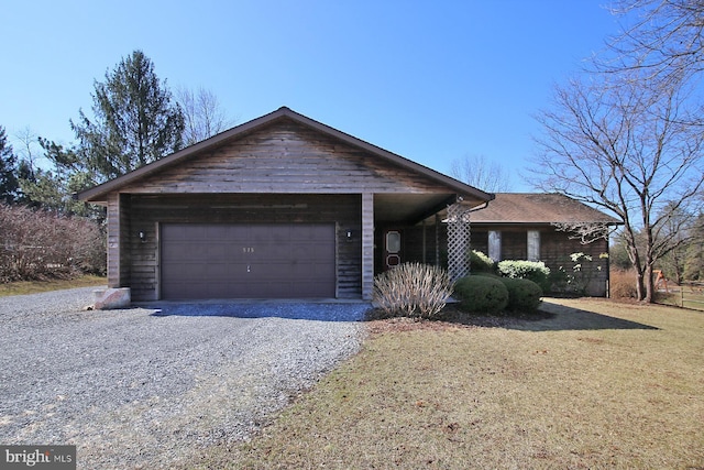 single story home with an attached garage and driveway