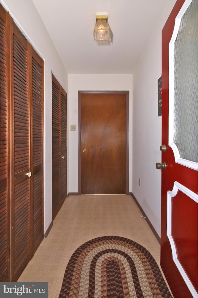 corridor featuring baseboards