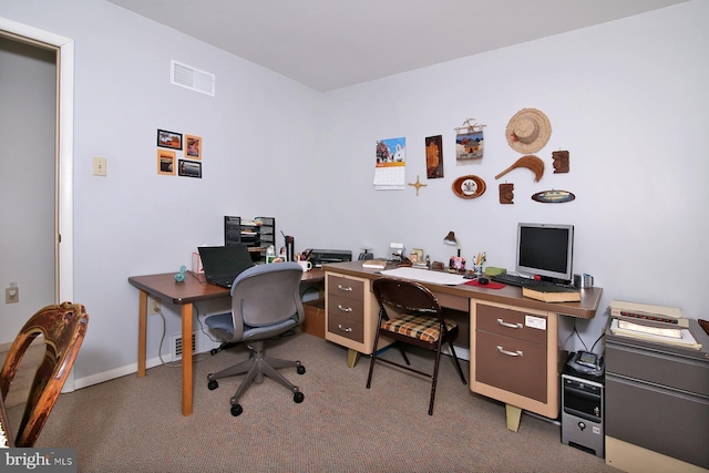 carpeted home office featuring baseboards and visible vents