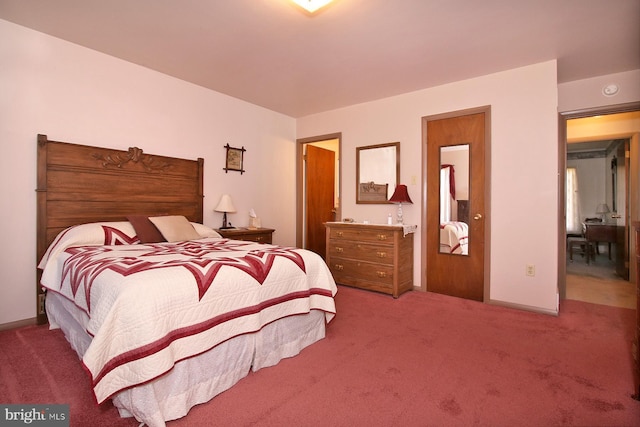 carpeted bedroom with baseboards