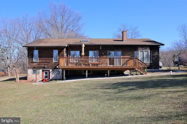 view of front of home with a chimney, a deck, and a front yard