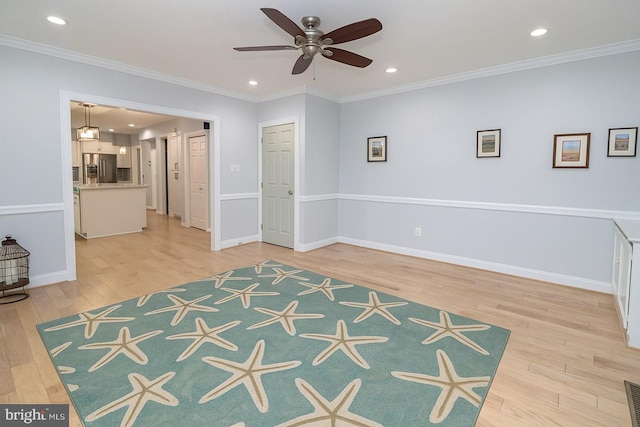 interior space featuring crown molding, visible vents, light wood-style floors, stainless steel refrigerator with ice dispenser, and recessed lighting