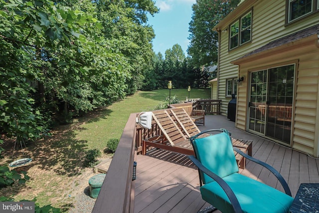 wooden terrace with a yard