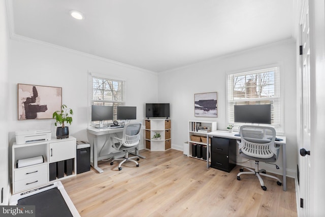 office area with light wood-style flooring, baseboards, and ornamental molding