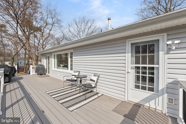 wooden deck featuring grilling area