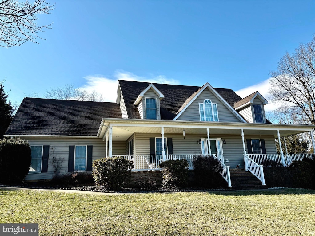 view of front of house featuring a front yard and covered porch