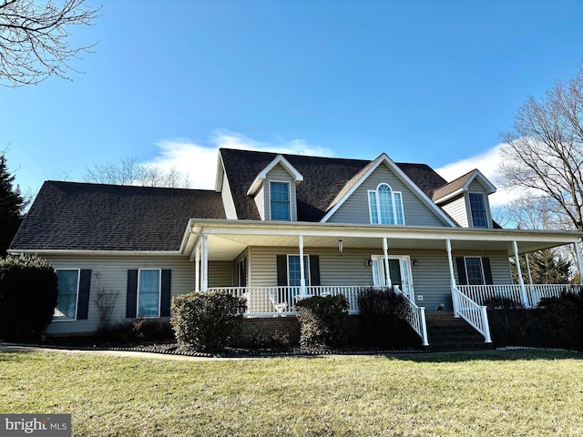 view of front of house featuring a front yard and covered porch