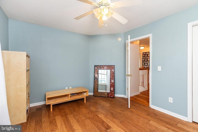 unfurnished bedroom featuring baseboards and wood finished floors