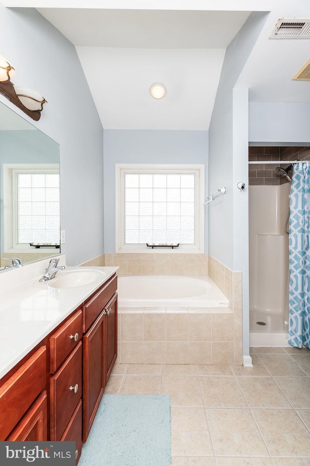 full bath with tile patterned floors, visible vents, curtained shower, a bath, and vanity