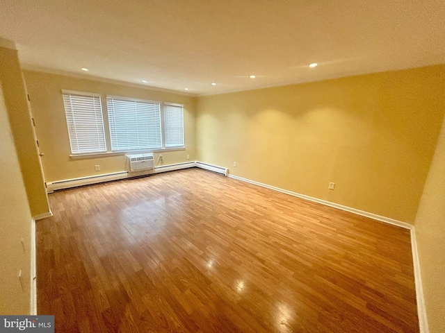 unfurnished room featuring recessed lighting, baseboards, and wood finished floors