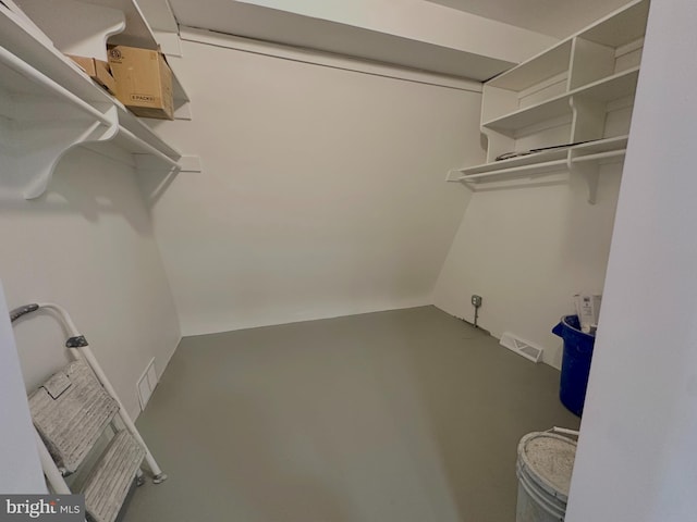 spacious closet featuring visible vents