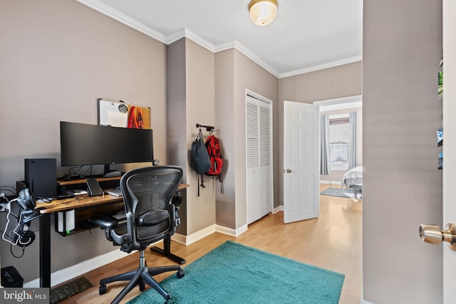 office space featuring wood finished floors, baseboards, and ornamental molding