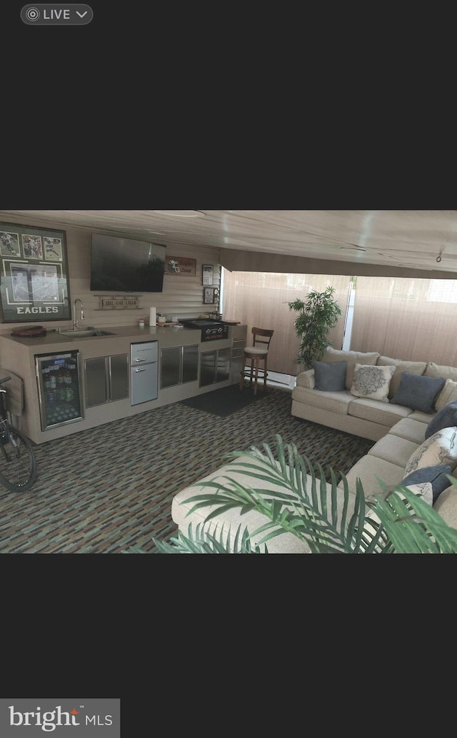 1858 47th St, Pennsauken, NJ 08110 - carpeted living area featuring beverage cooler and a sink