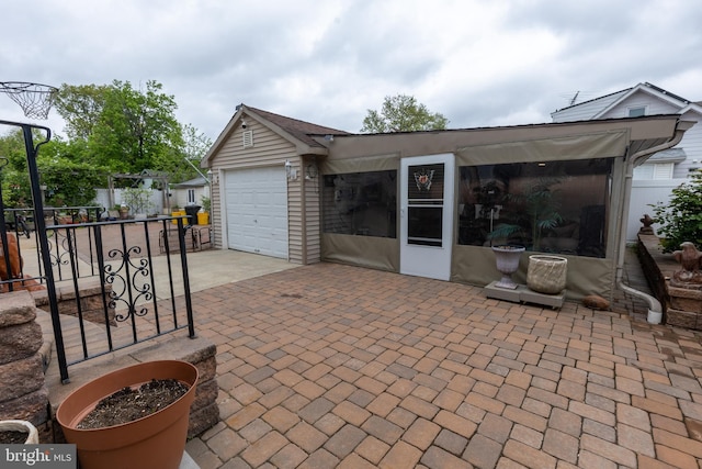 1858 47th St, Pennsauken, NJ 08110 - view of patio / terrace featuring a garage, fence, and driveway