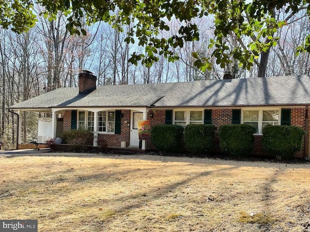 13360 Fredericksburg Tpke, Woodford, VA 22580 - ranch-style home with brick siding, roof with shingles, and a chimney