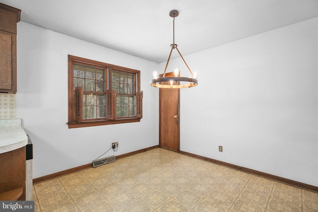 13360 Fredericksburg Tpke, Woodford, VA 22580 - unfurnished dining area featuring baseboards, visible vents, light floors, and a chandelier