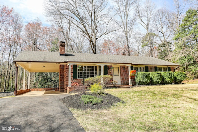 13360 Fredericksburg Tpke, Woodford, VA 22580 - ranch-style house featuring driveway, a front yard, brick siding, a carport, and a chimney