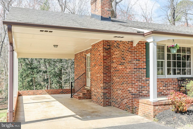 13360 Fredericksburg Tpke, Woodford, VA 22580 - view of patio featuring a carport, entry steps, and concrete driveway