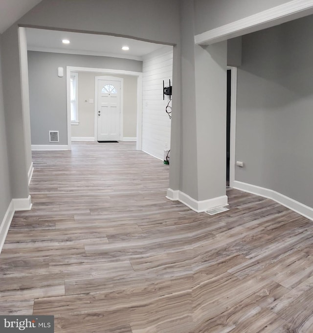 interior space featuring recessed lighting, wood finished floors, visible vents, and baseboards