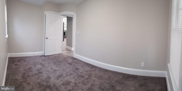 interior space featuring baseboards