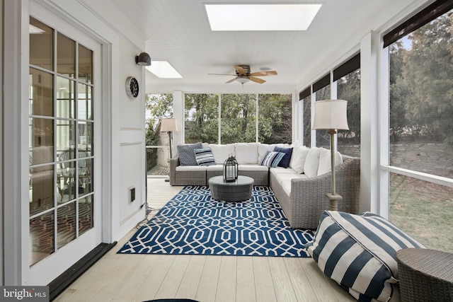 sunroom / solarium with a skylight and a ceiling fan