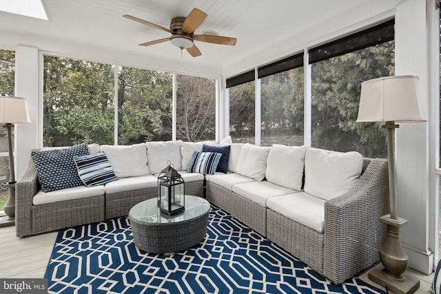 sunroom / solarium with plenty of natural light and ceiling fan