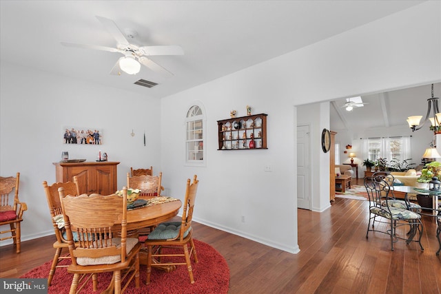 dining area featuring visible vents, baseboards, a ceiling fan, and hardwood / wood-style floors