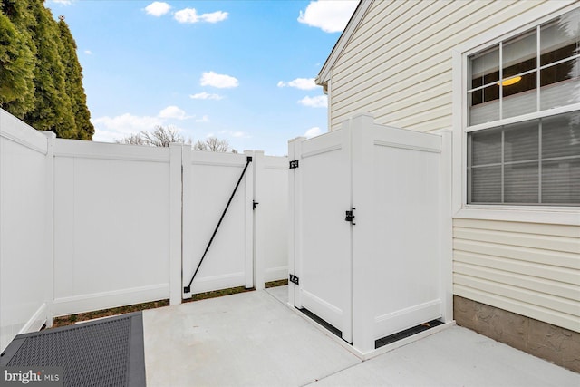 view of patio / terrace with fence and a gate