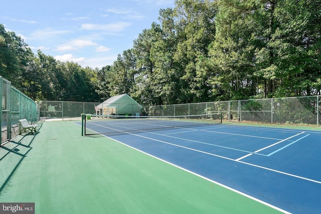 view of sport court with fence