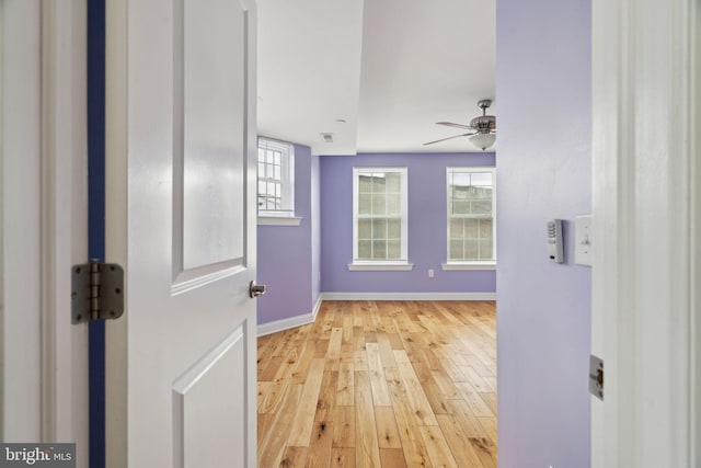 interior space with visible vents, baseboards, and light wood finished floors