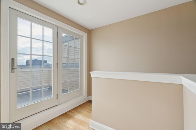 doorway featuring wood finished floors