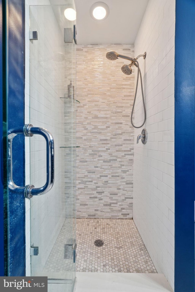 bathroom featuring a shower stall