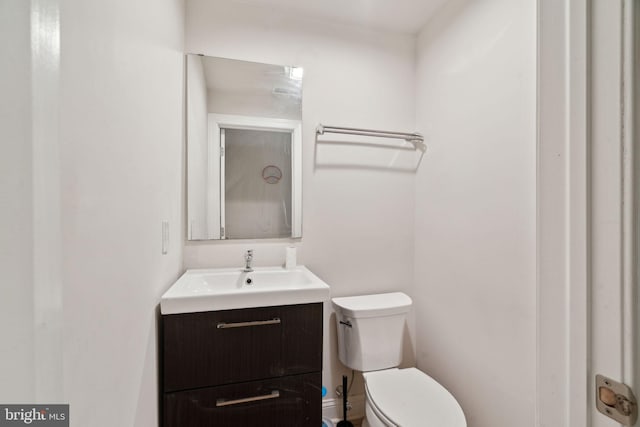 half bath with toilet and vanity