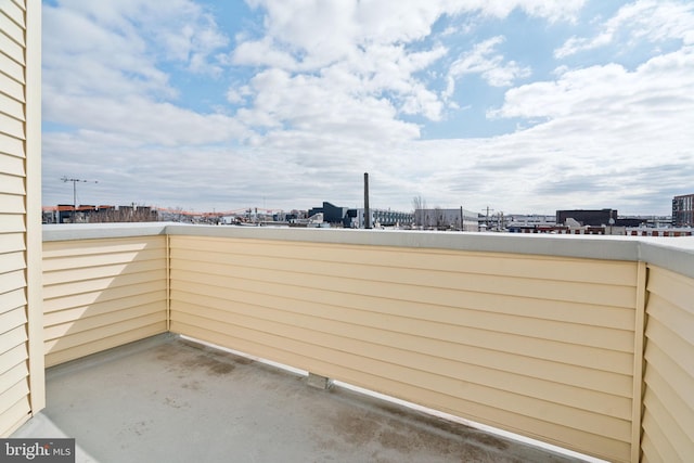 view of patio / terrace featuring a city view and a balcony