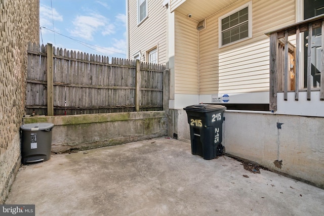 view of patio featuring fence