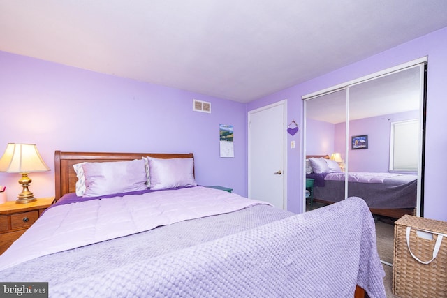 bedroom with visible vents and a closet