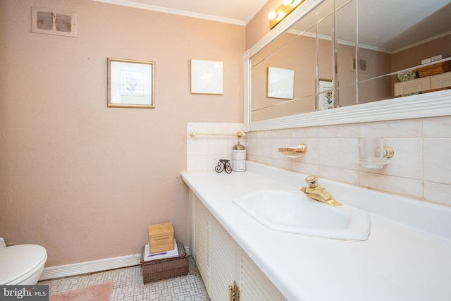 bathroom with tasteful backsplash, visible vents, toilet, ornamental molding, and vanity