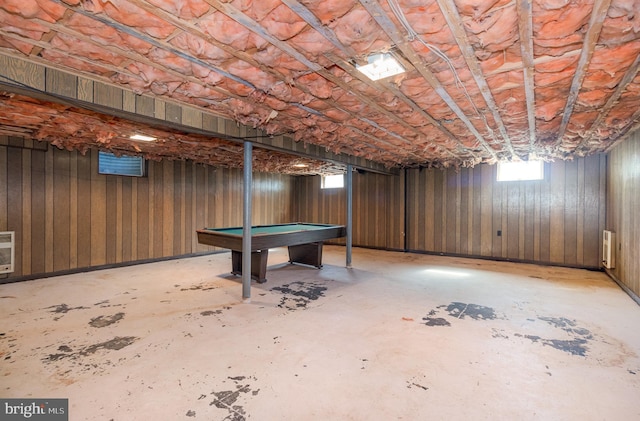 game room featuring billiards, unfinished concrete floors, and heating unit