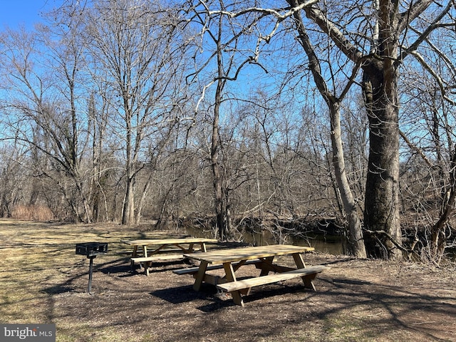 view of community with a forest view