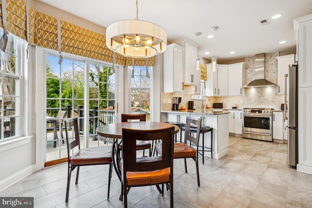 dining room featuring recessed lighting, visible vents, baseboards, and a chandelier