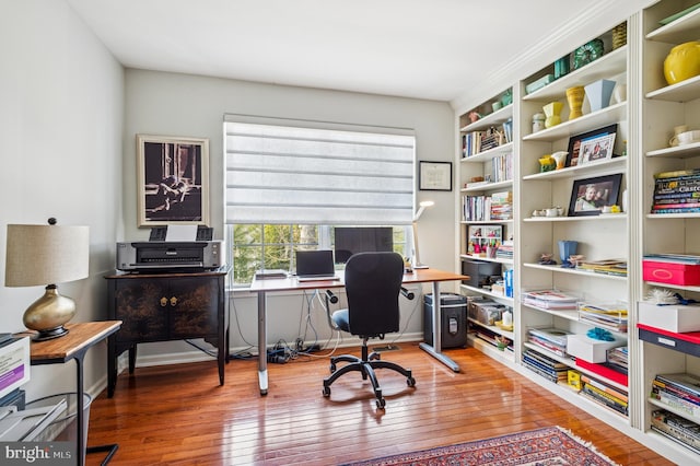 office space with wood-type flooring