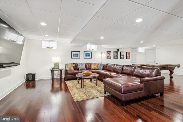 living area with recessed lighting, baseboards, and dark wood-style flooring