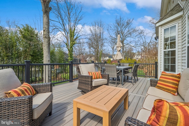 deck with outdoor dining space