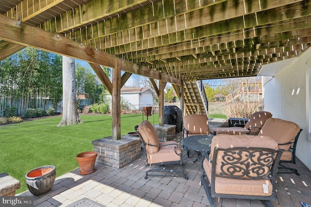 view of patio featuring stairway, a grill, and fence