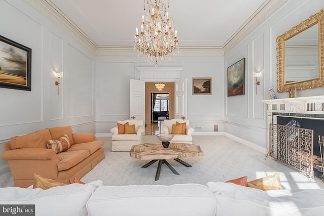 living room with ornamental molding, a high end fireplace, and a decorative wall