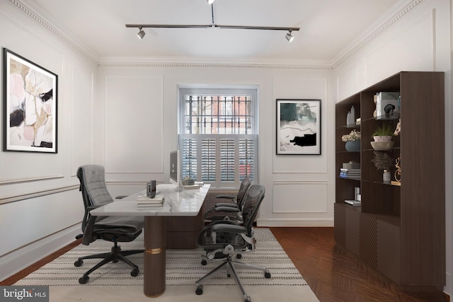 office space with a decorative wall, track lighting, and crown molding