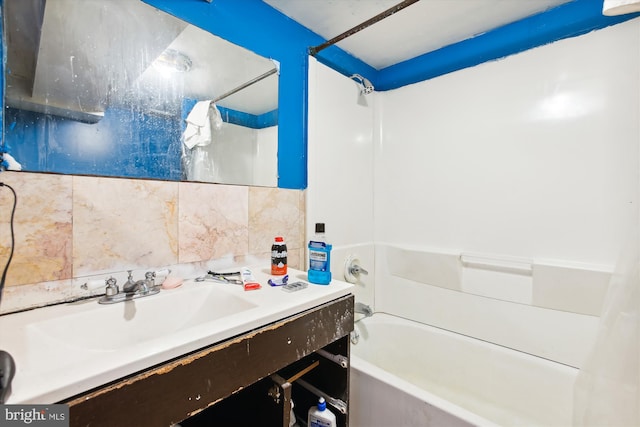 bathroom with shower / bath combination, tasteful backsplash, and vanity