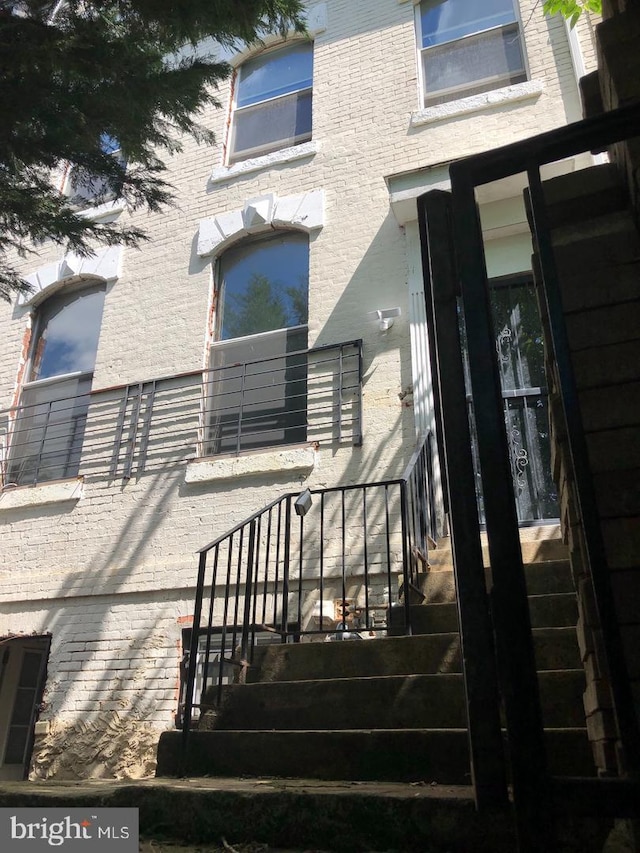 entrance to property with brick siding