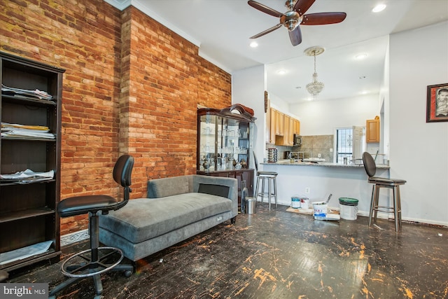 living area with ceiling fan, baseboards, brick wall, and recessed lighting