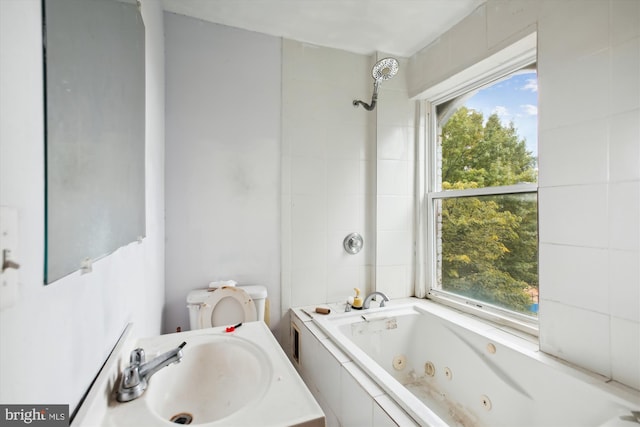 full bathroom featuring a sink and a wealth of natural light